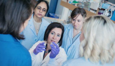 A GROUP OF RESEARCHERS IN A LAB