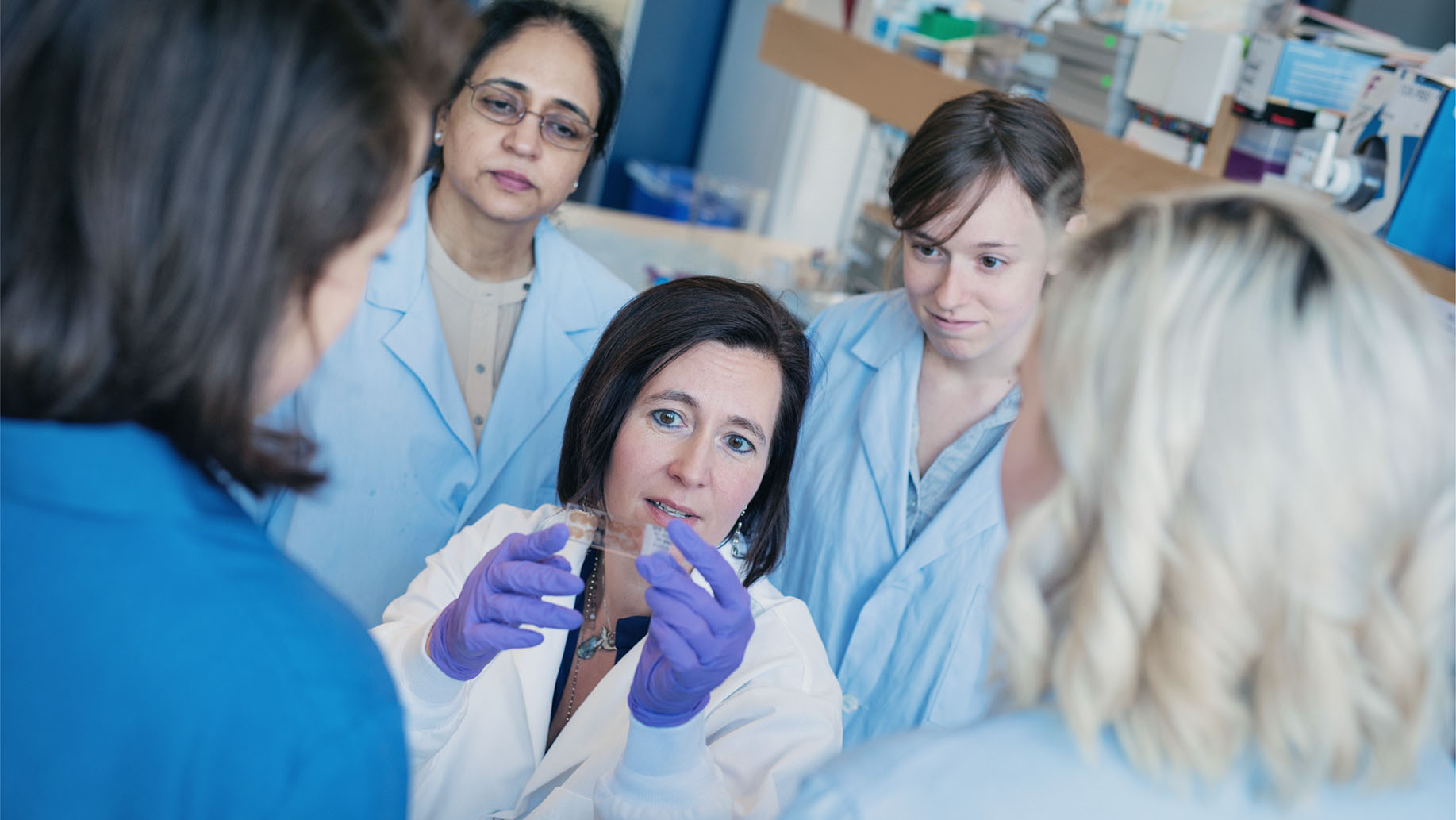 A GROUP OF RESEARCHERS IN A LAB